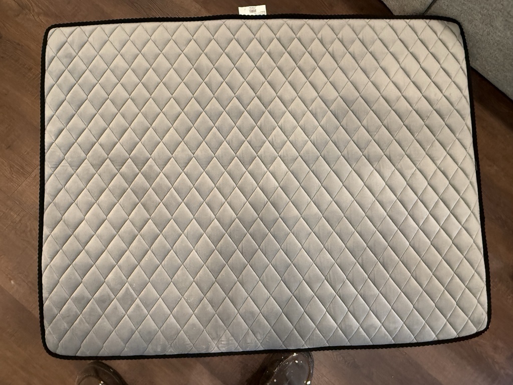 Top view - quilted surface, tag attached