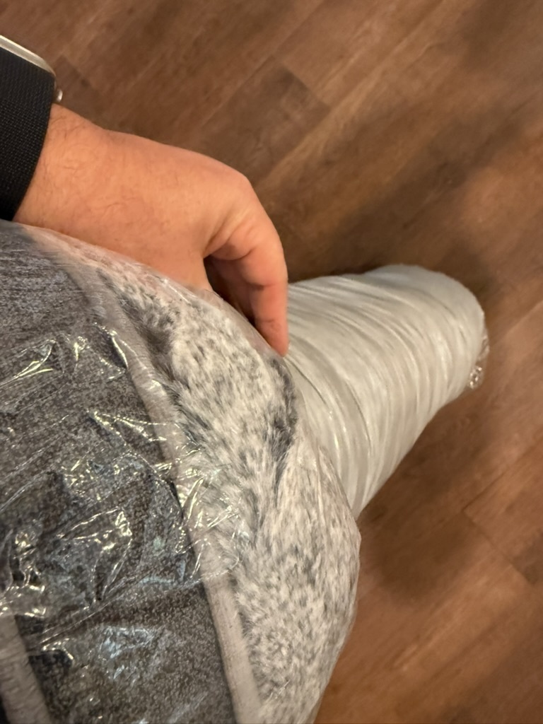 Gray faux fur and bolster through the wrap