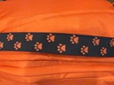 Paw-print strap and zip detail